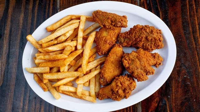 Six Pcs Chicken Wings with Fries.