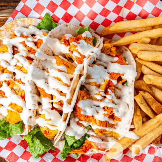 Three Chicken Tacos with Fries.